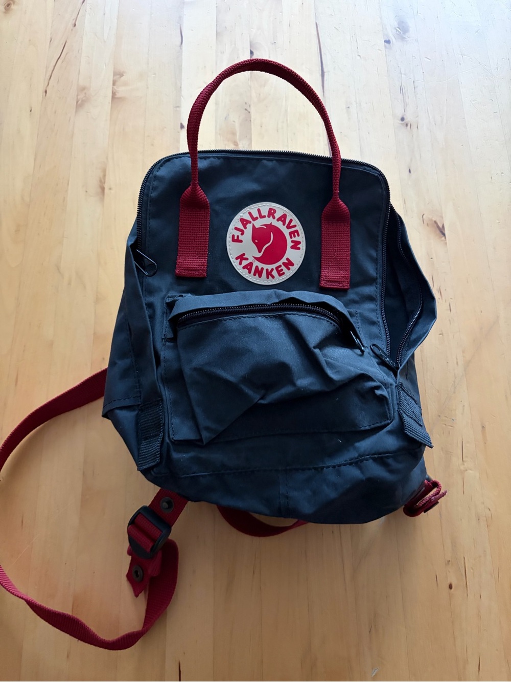 Kånken Mini Backpack in Black with Red Accents